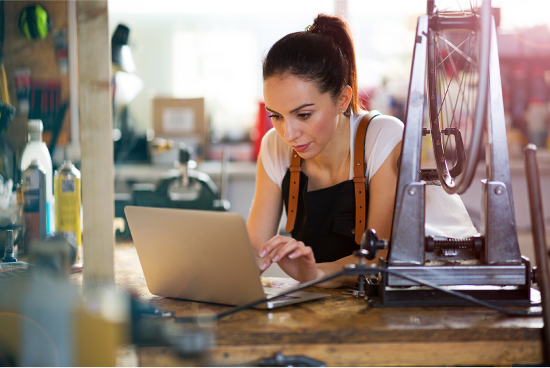 Thank You - Person on laptop in workshop